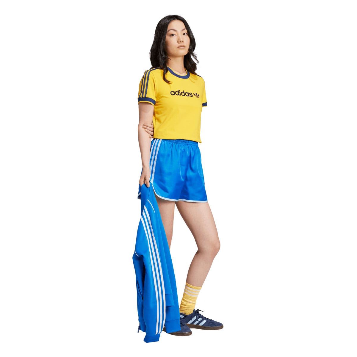 Yellow slim T-shirt with blue crew neck and sleeve 3-stripe detailing on model.