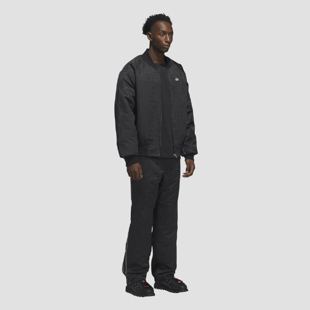 adidas Originals black tracksuit bottoms worn, straight leg and elastic waist