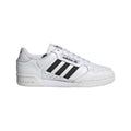White adidas low-top trainers with black three stripes and lace-up front