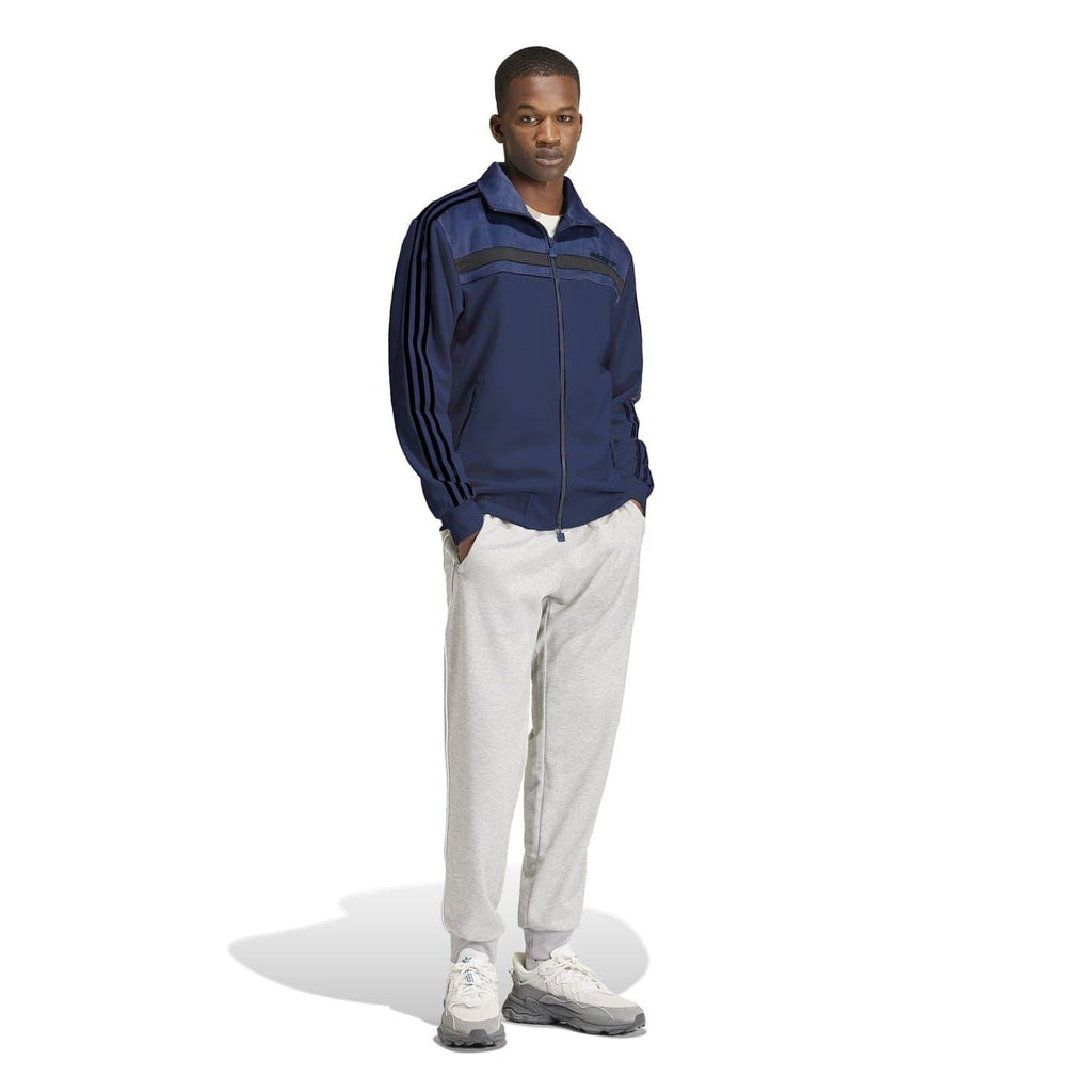 Navy zip-up athletic top with funnel neck, sport stripes, and regular fit