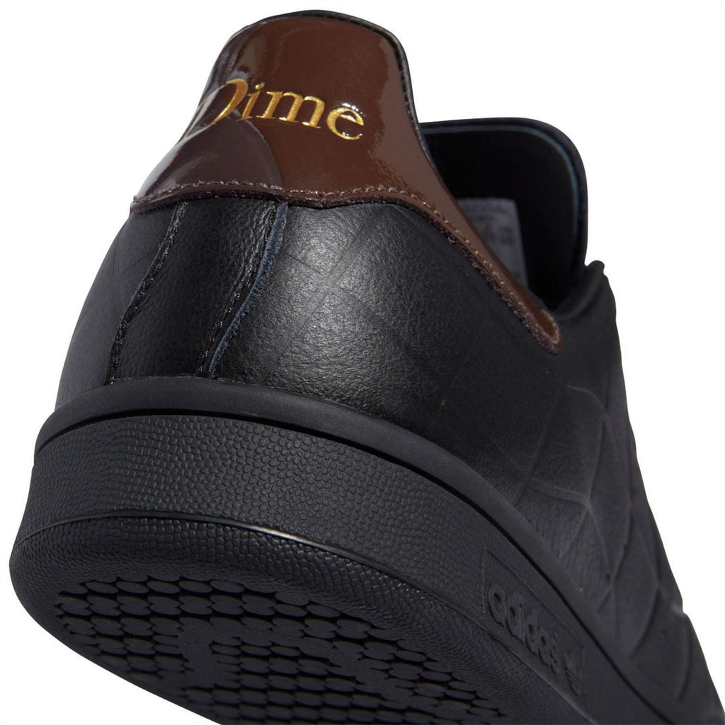 Black trainers with brown back heel panel and cushioned collar