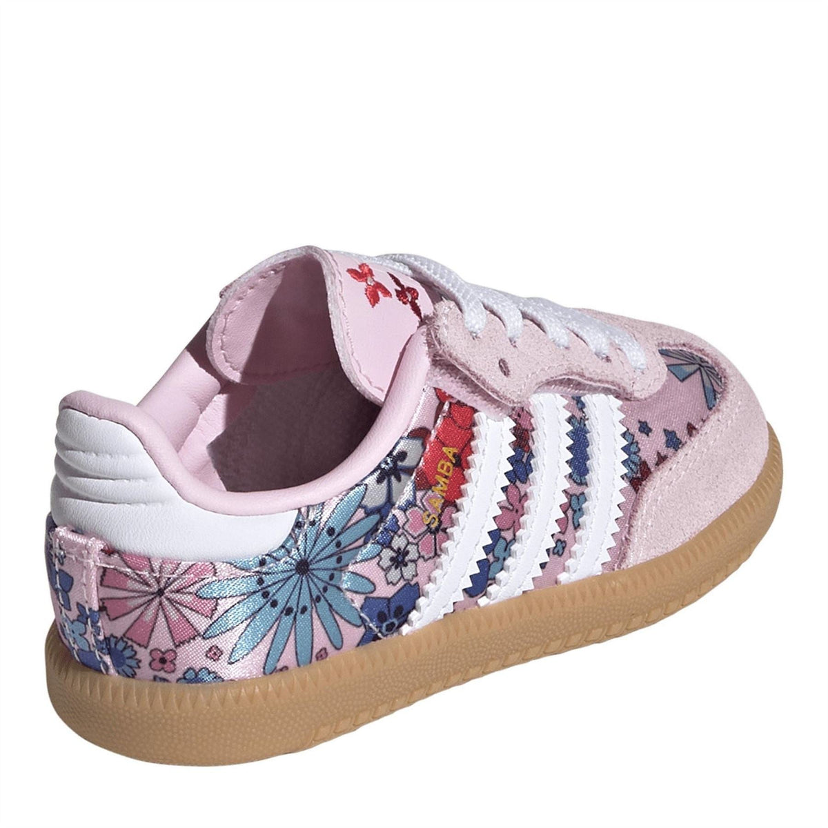 Pink and white low-top sneaker with patterned collar lining, lace-up front, gum outsole.