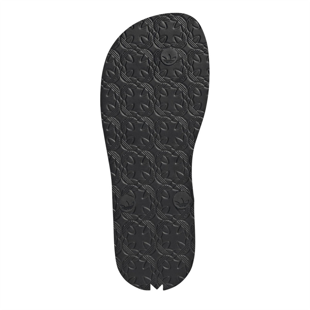 Black rubber flip-flop outsole with embossed leaf-pattern tread