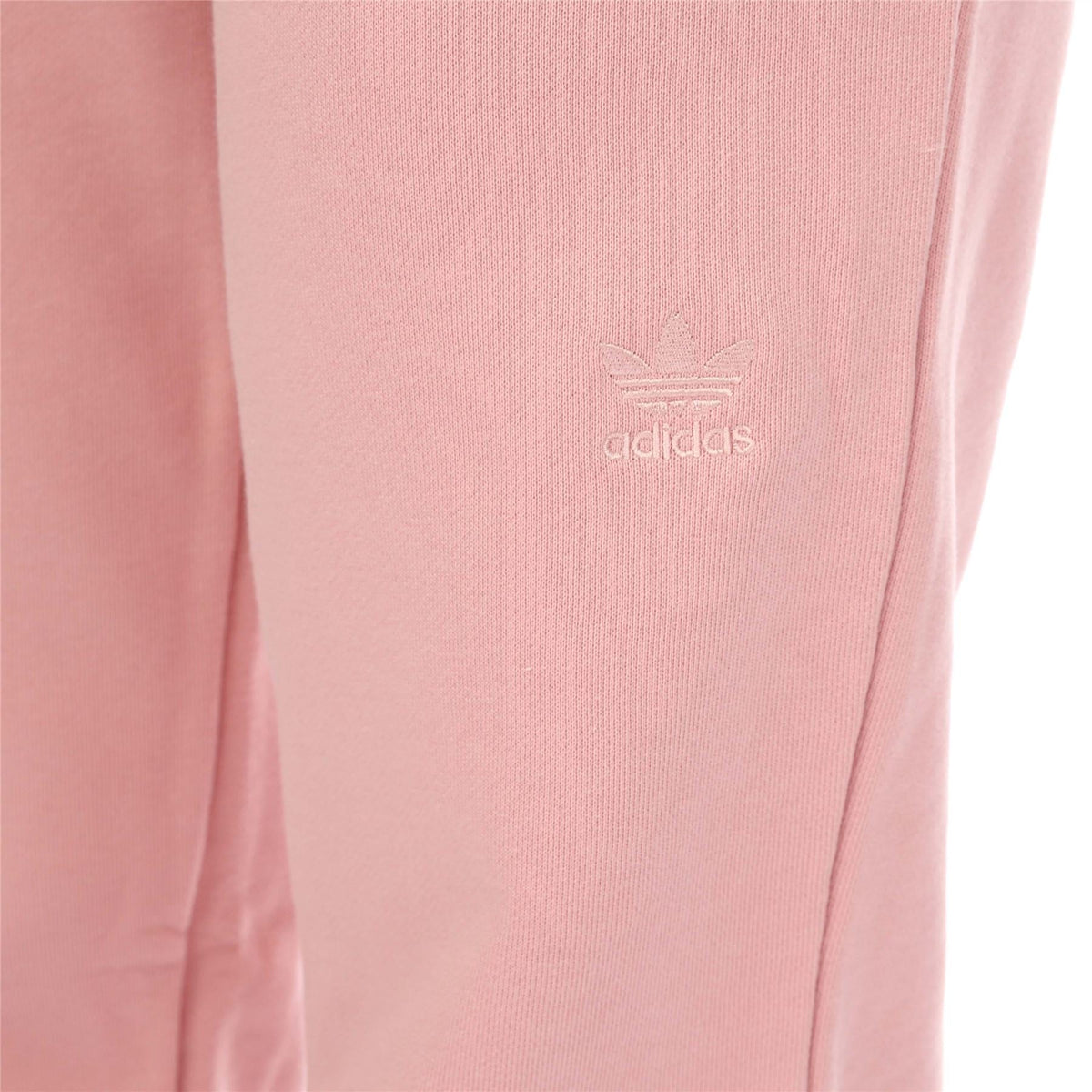 Pink joggers with adidas trefoil logo on thigh
