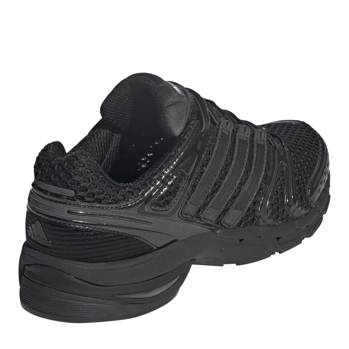 Black sneaker heel and side view with layered cushioning and molded ridges