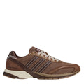Brown mesh running shoes with striped panels, white laces, and cream midsole.