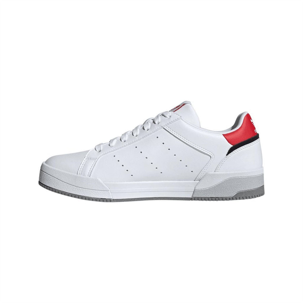 adidas Originals Tourino Trainers in black and white, sporty footwear with sleek design and cushioned sole.