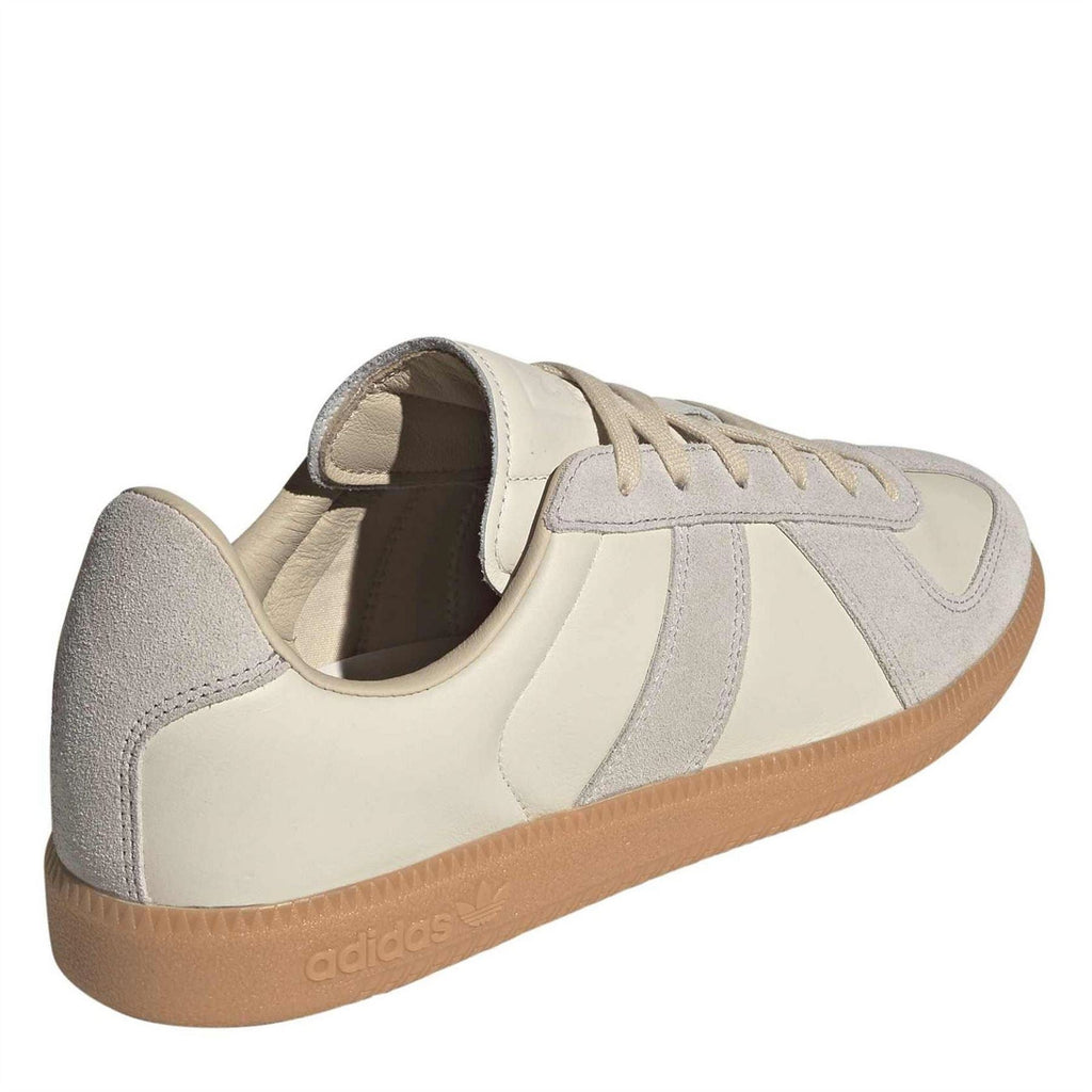 Cream and gray lace-up sneakers with padded collar and gum rubber sole