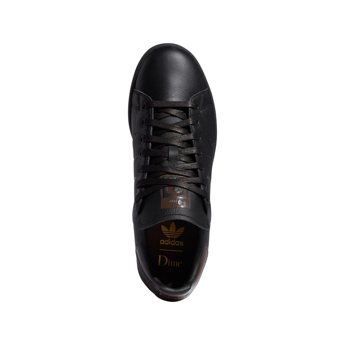 Black lace-up trainers with brown tongue label and textured toe cap