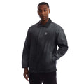 Black coach overshirt with button front, collar, chest logo, and two side pockets