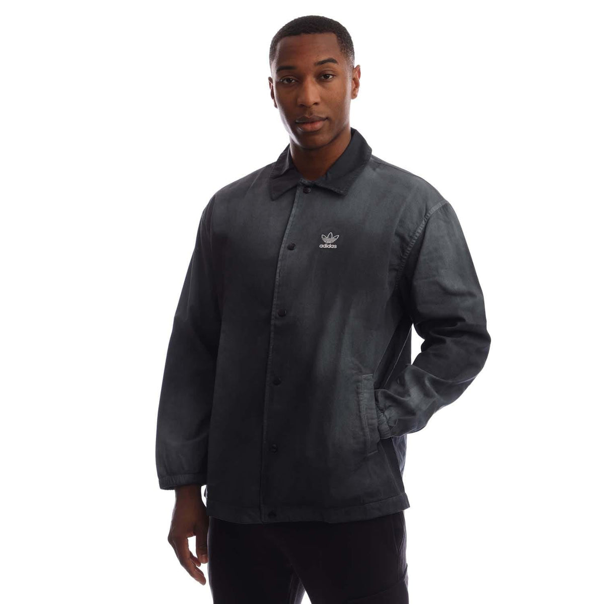 Black coach overshirt with button front, collar, chest logo, and two side pockets