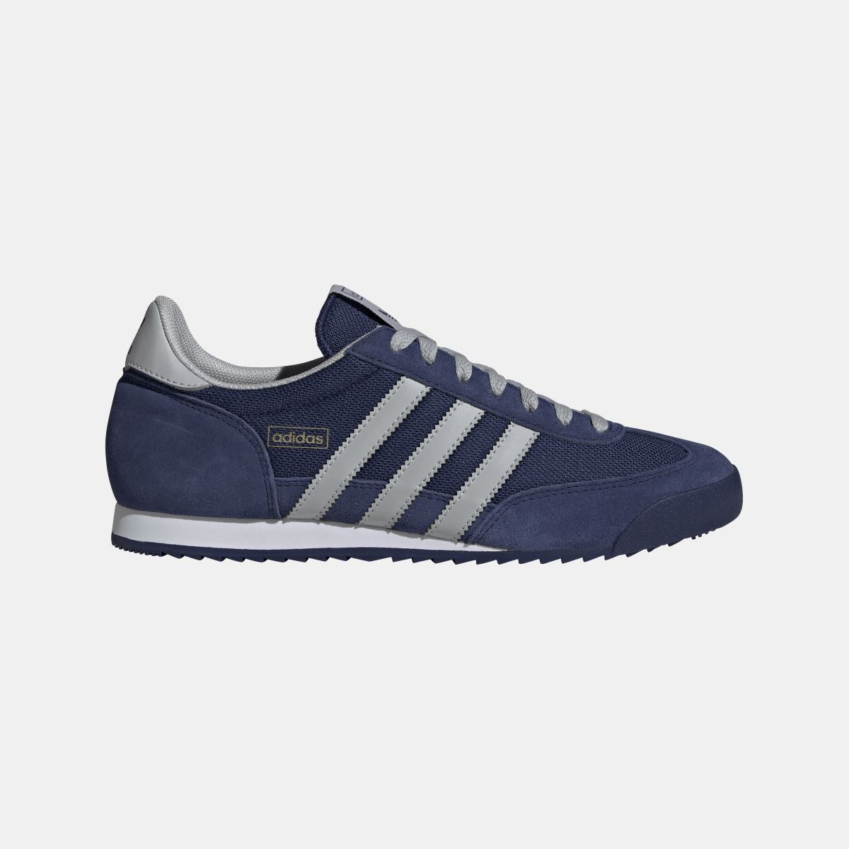 adidas Originals R71 shoes in white with black accents, featuring classic sneaker design and rubber sole on a clean background