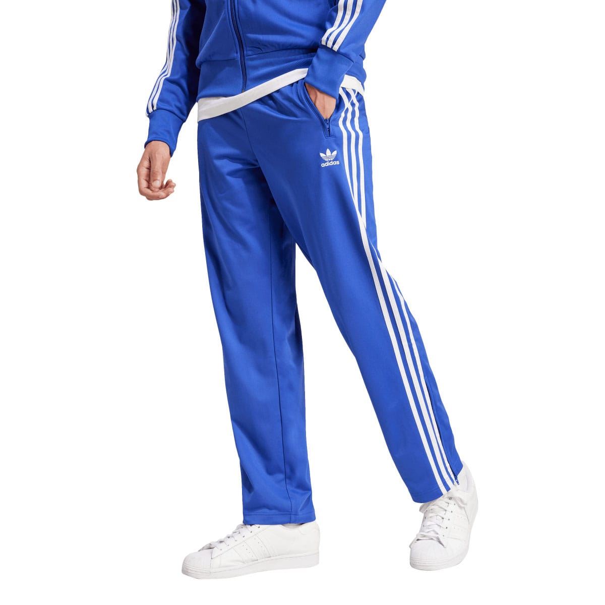 Blue adidas Originals Firebird track pants with white triple stripe legs