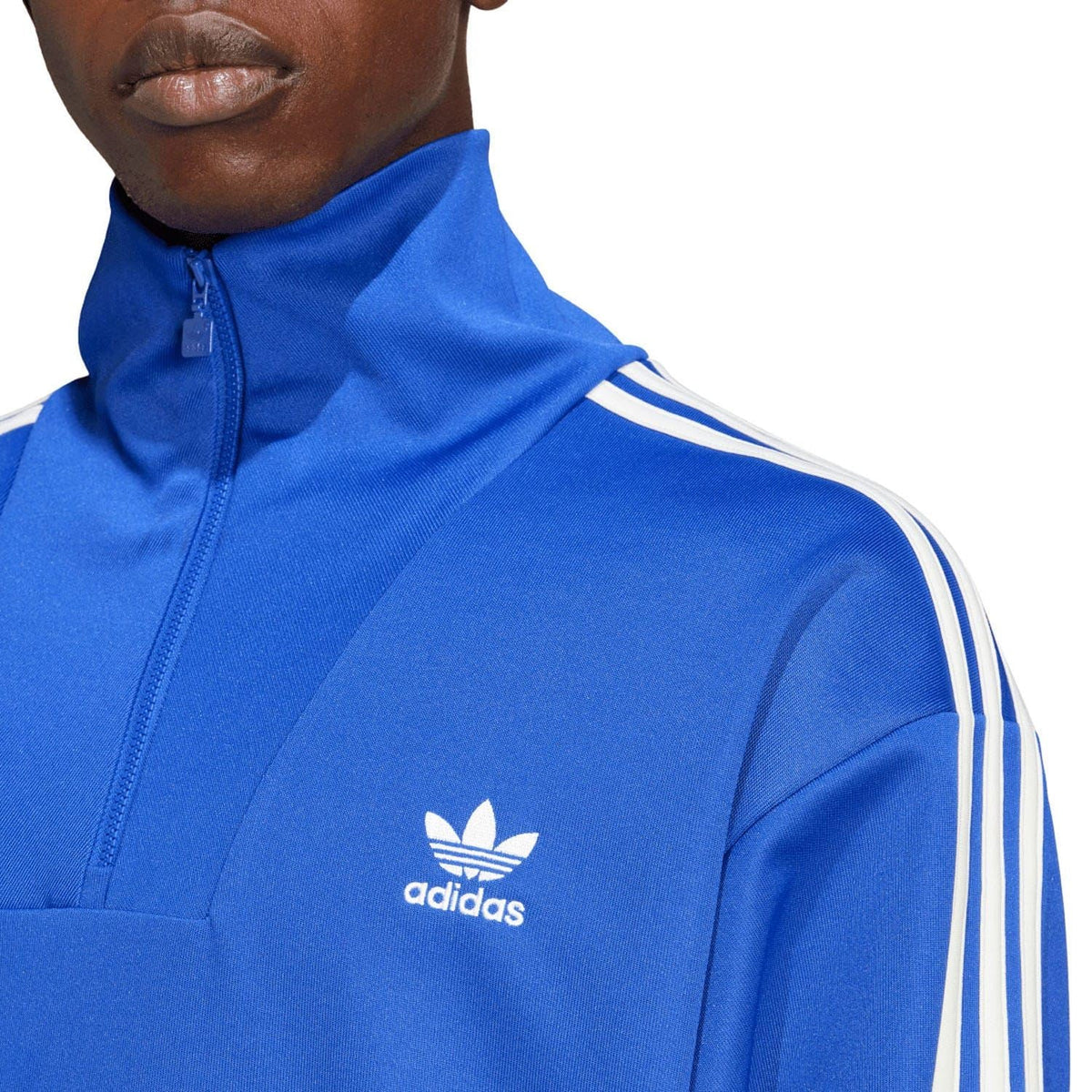 Blue adidas funnel-neck track top with front trefoil logo and zip collar stripe detail.