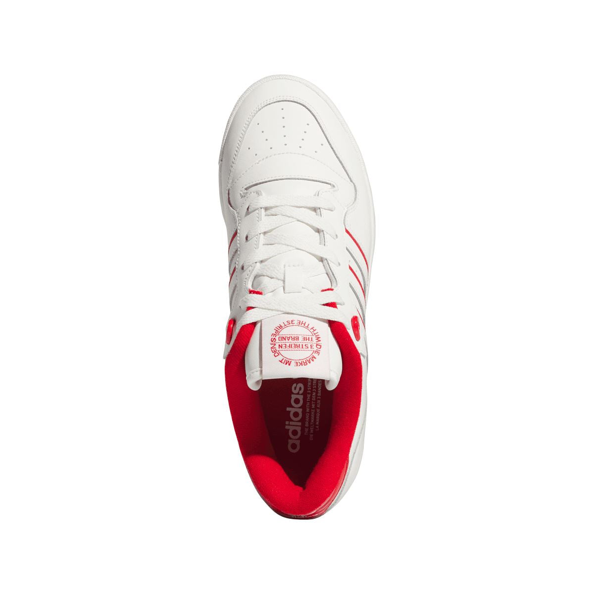 White leather-style sneaker with red inner lining and lace-up front opening.