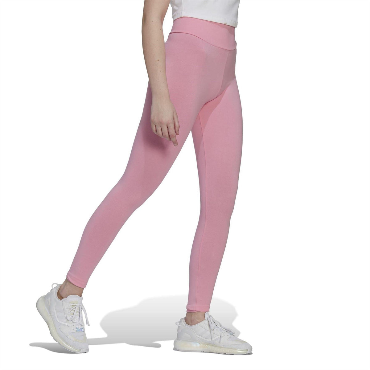 adidas Originals tight legging for fitness and gymwear, shown in black with a close-up of high-waisted design and stretchy fabric