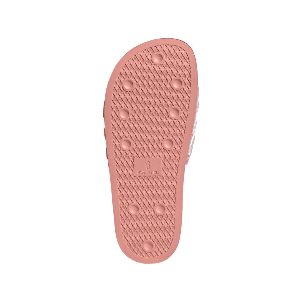 Mauve adidas Adilette slide sandal outsole with traction nubs and embossed logo