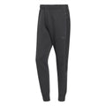 Black track pants with ribbed cuffs and three-stripe side panels, adidas trefoil logo