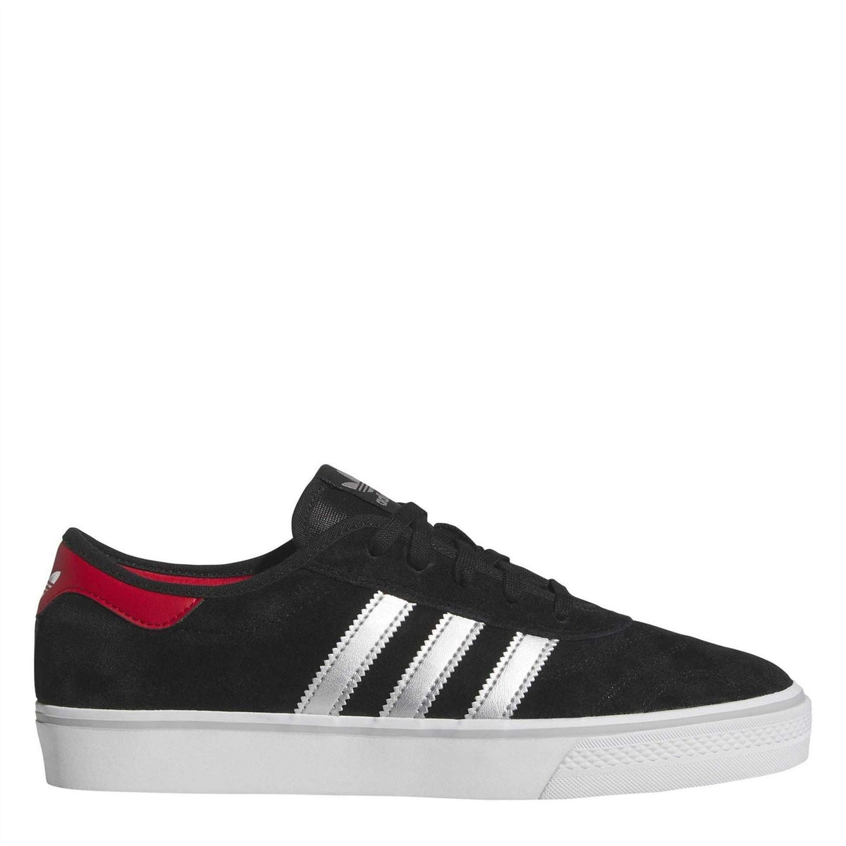 Black suede low-top sneaker with white triple stripes and red heel accent, lace-up.