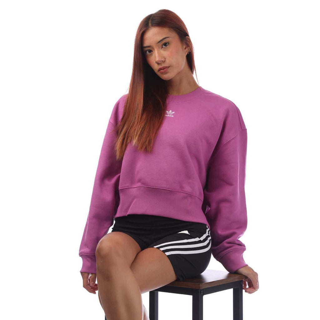 Purple crewneck sweatshirt with adidas trefoil logo and relaxed long sleeves