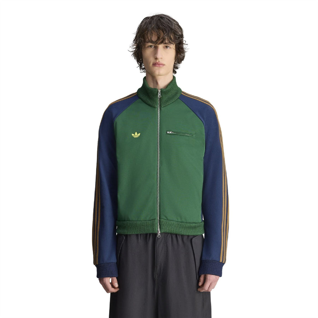 Green and navy track top with stand collar, full zipper, and gold triple stripe sleeves