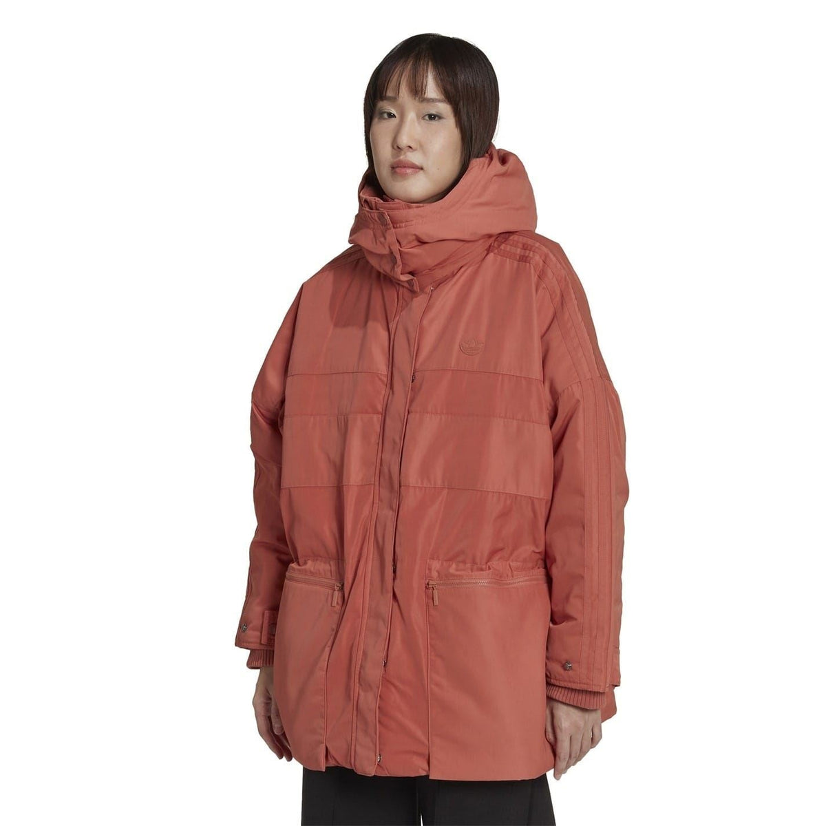 Burgundy hooded parka on model, relaxed fit with front zip and flap chest pockets.