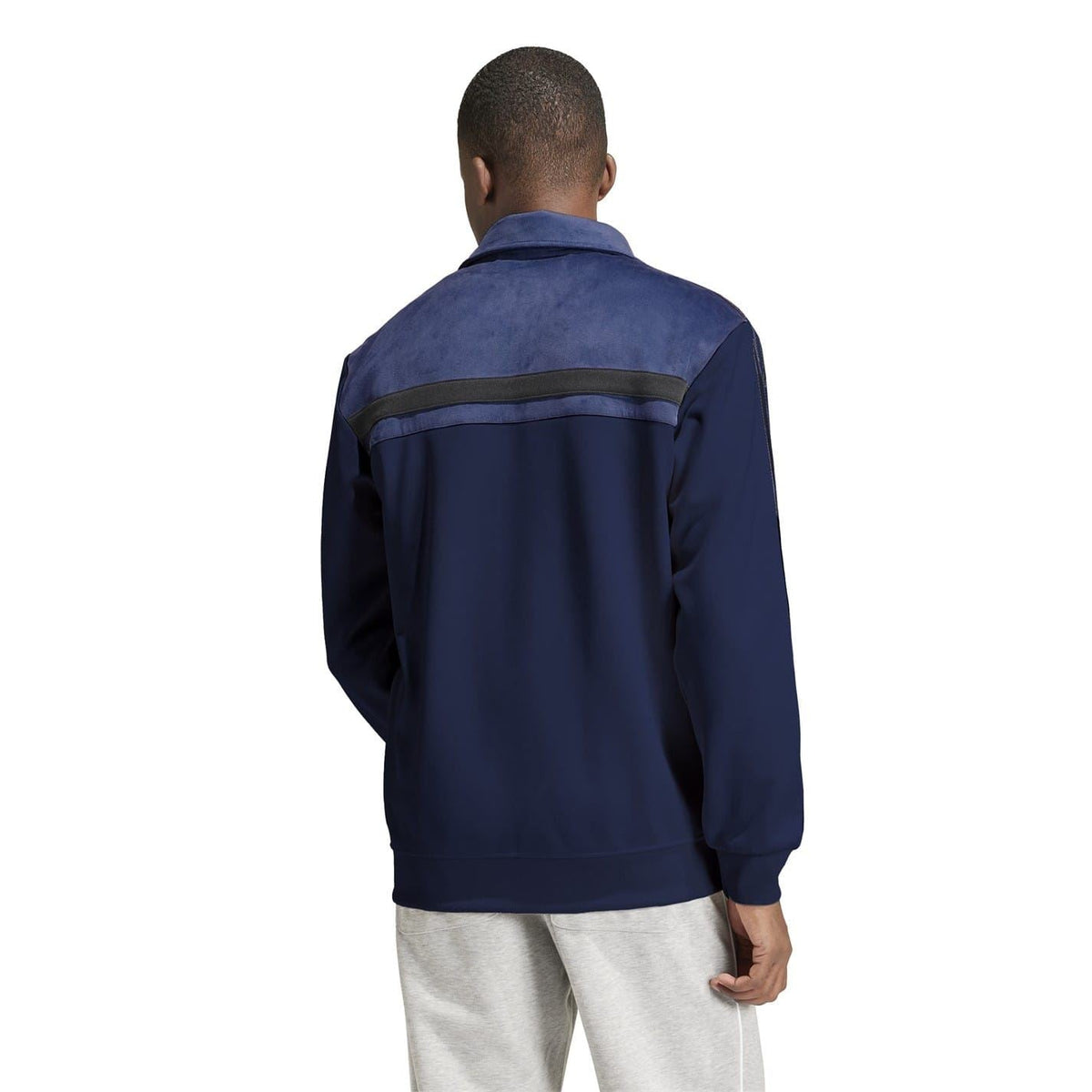 Back view of navy Adidas Originals athletic top with funnel neck and striped yoke