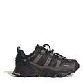 Black adidas hiking-style sneaker with chunky tread and lace-up closure.
