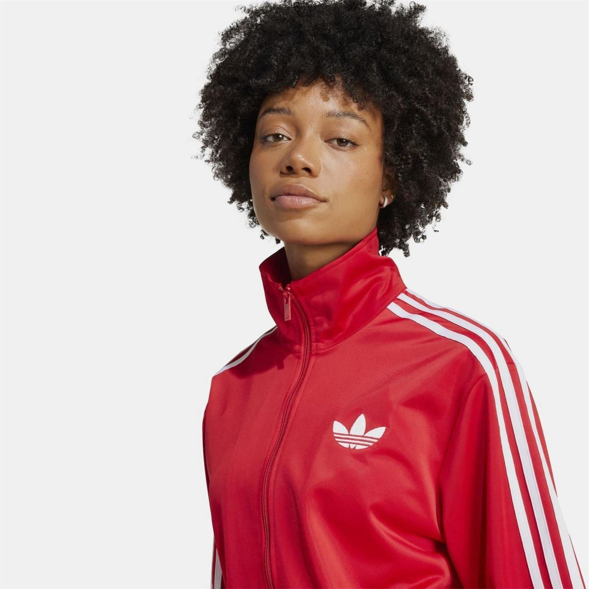 adidas Originals Classic Firebird loose track top sweatshirt in black with iconic zip-up design and ribbed cuffs.