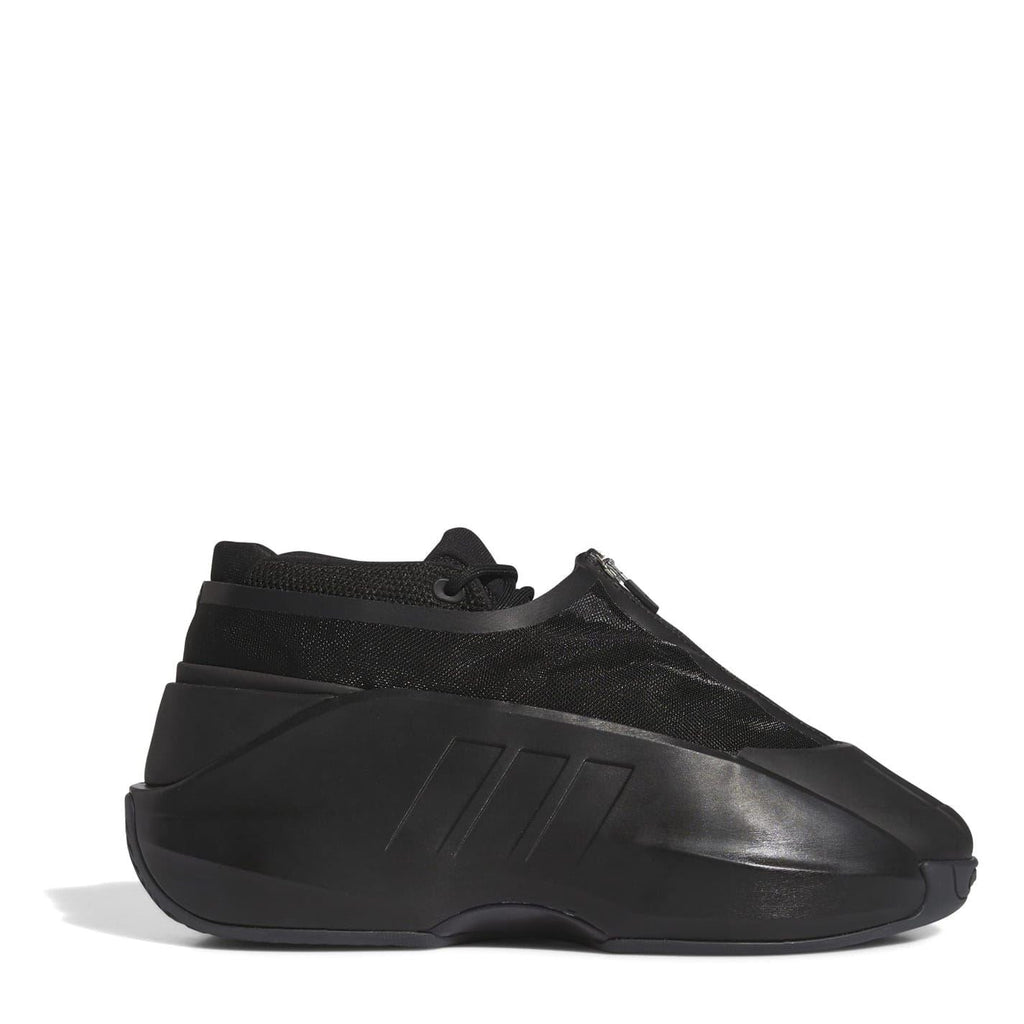 Black infant trainers with knit upper, textured overlays, and molded side panel