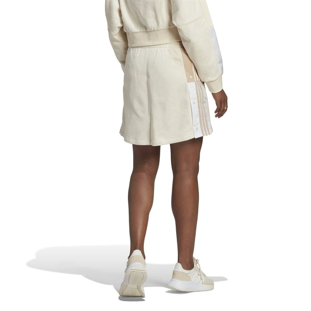 Light mini skirt with elastic waistband and contrast stripe panel on the side
