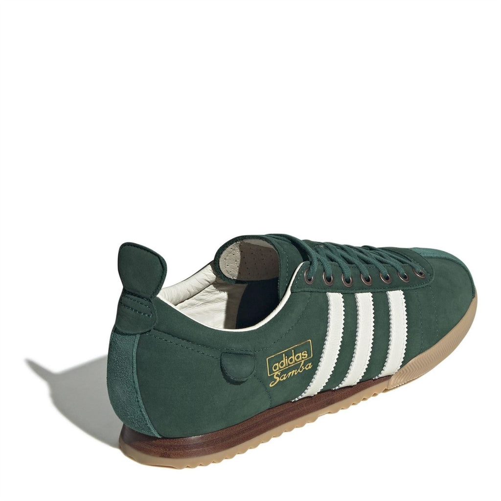 Green suede low-top sneakers with white stripes and lace-up front, side view