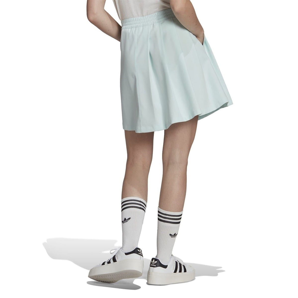 Adidas Originals Adicolour contemporary tailored skirt in black with sleek design and subtle branding, styled for a modern look.