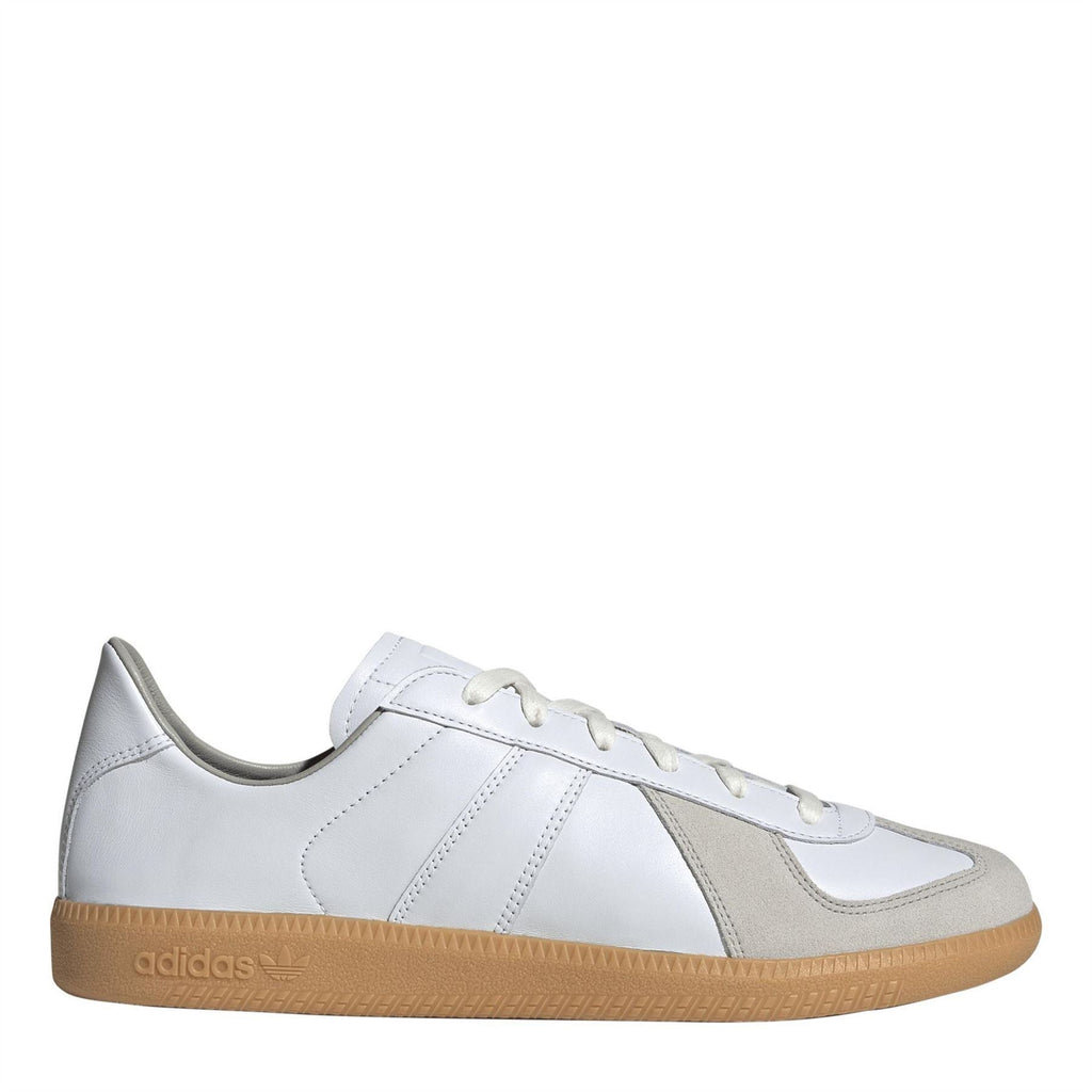 adidas low-top trainers in white and gray with lace-up closure and gum rubber sole
