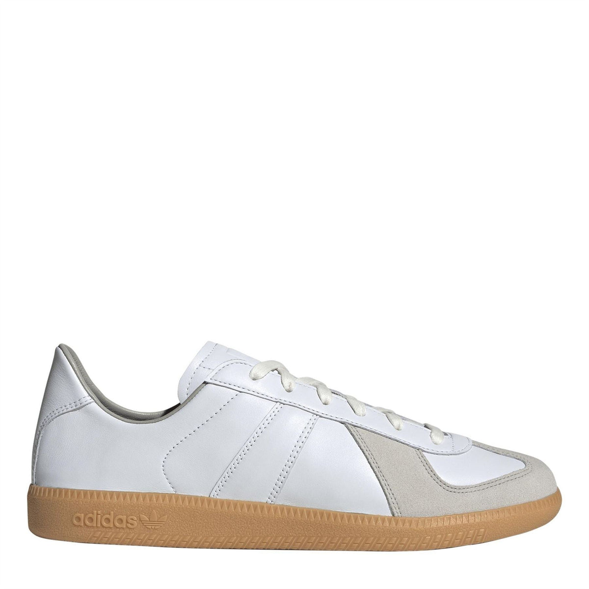 adidas low-top trainers in white and gray with lace-up closure and gum rubber sole