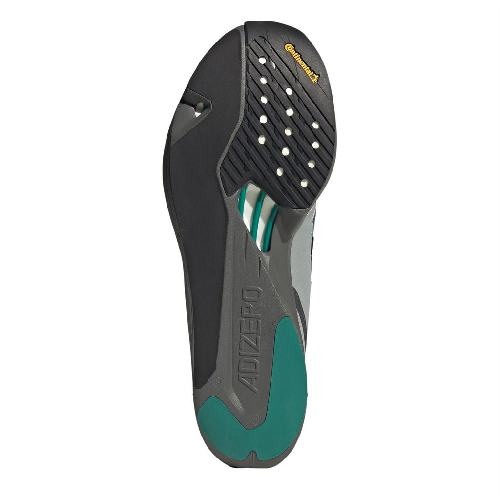 Outsole of light gray and black sneakers with teal geometric tread details