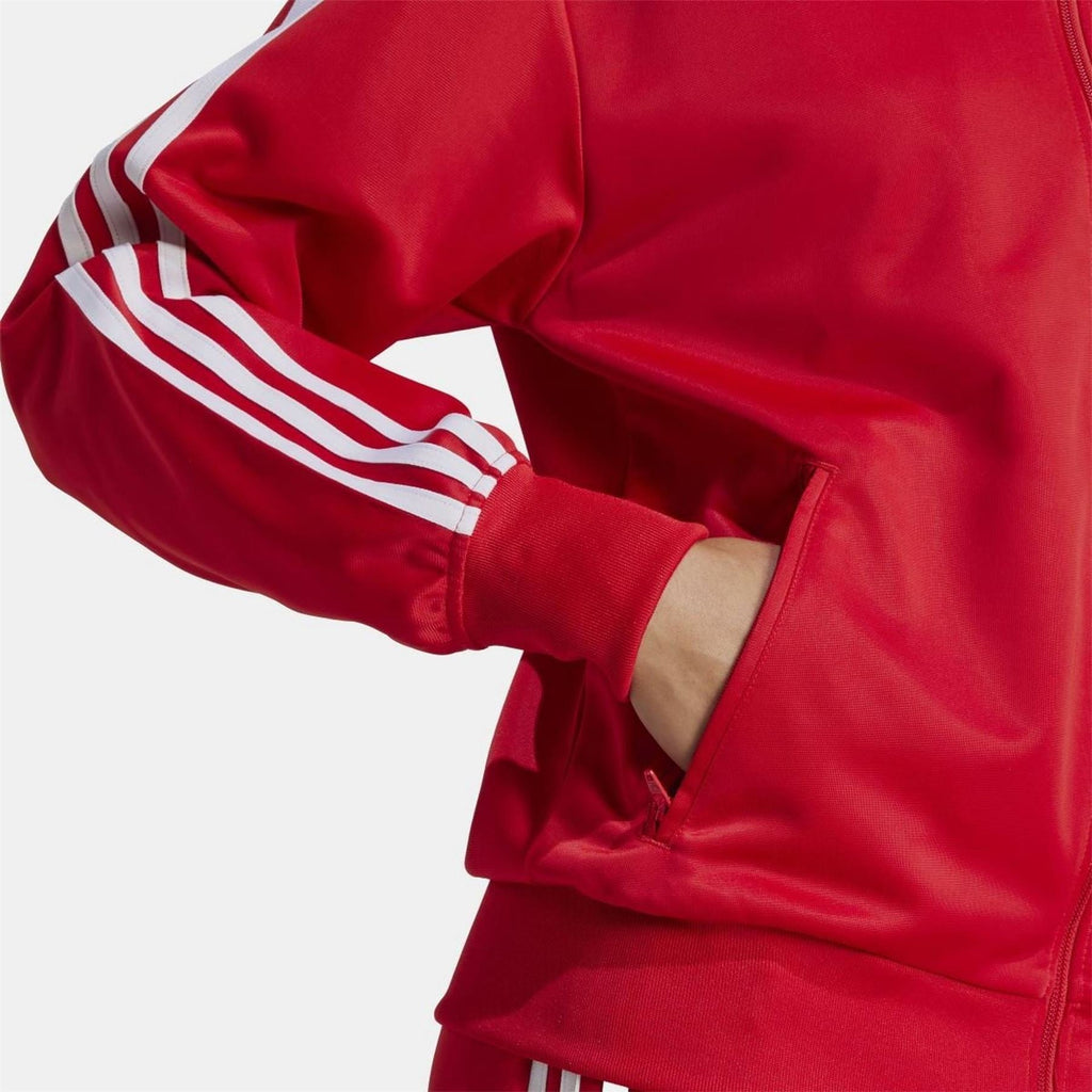 adidas Originals Classic Firebird loose track top sweatshirt with zip-up design and sporty style, shown on a hanger.