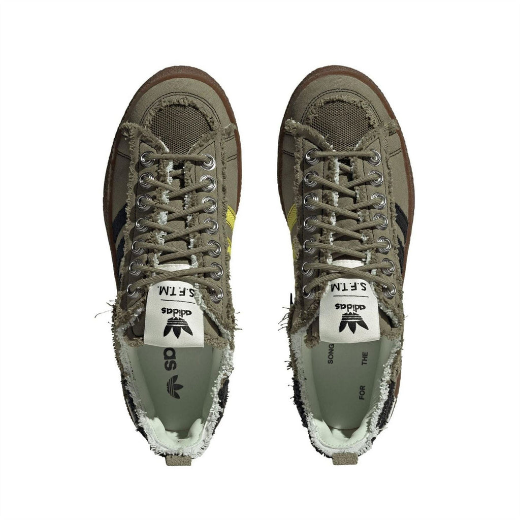 Olive lace-up trainers with tongue lining showing adidas Originals S.F.T.M label