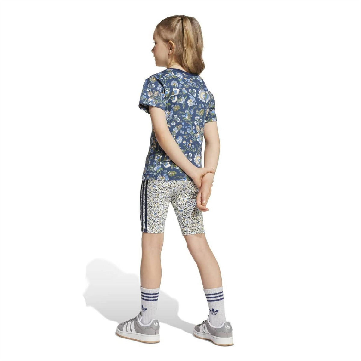 Girls set back view: navy floral T-shirt and white patterned bike shorts