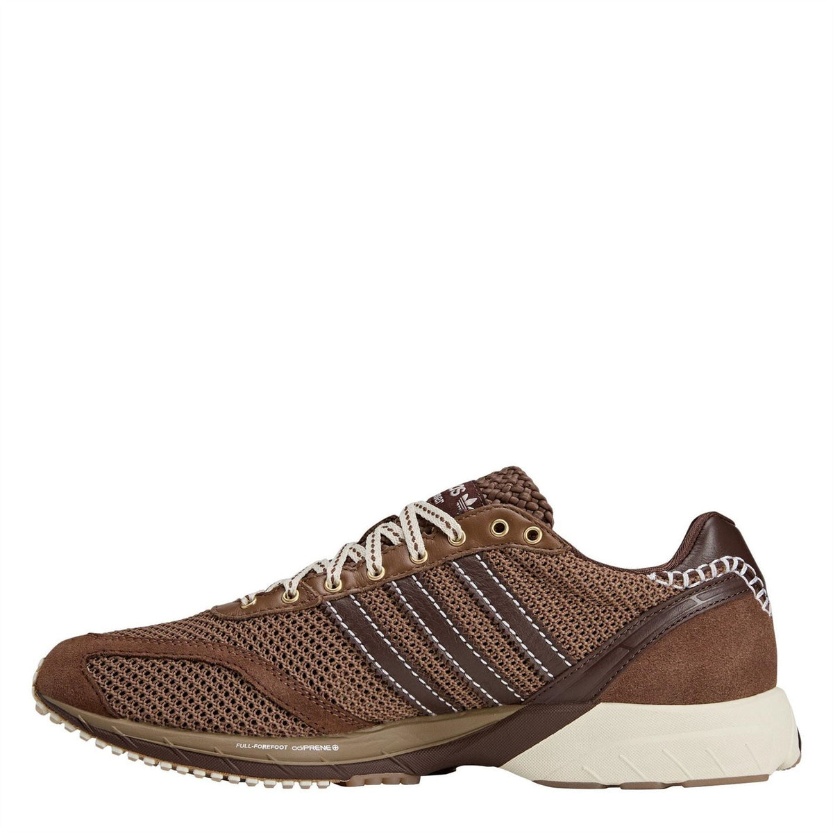 Brown and cream mesh sneakers with adidas-style stripes, lace-up front, side view.