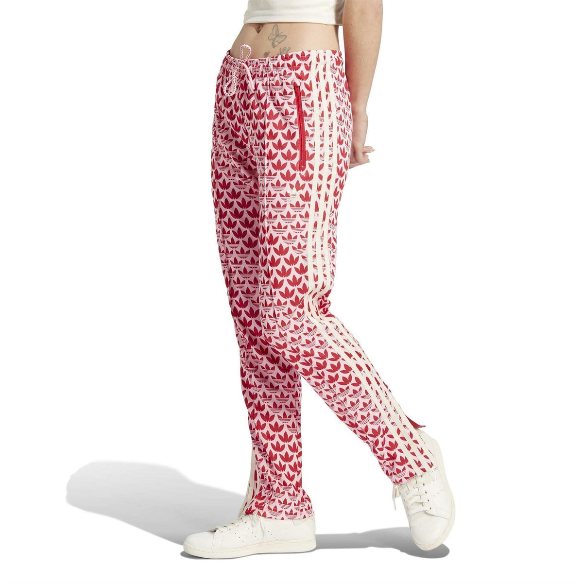 Red-and-white logo print track pants with drawstring waist and side stripes