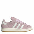 Pink suede lace-up trainers with white adidas stripes and beige rubber sole