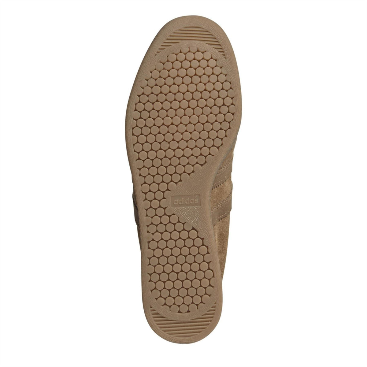 Brown low-top sneaker outsole with circular tread pattern and adidas logo