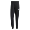 Black slim jogger pants with ribbed cuffs and adidas logo on thigh