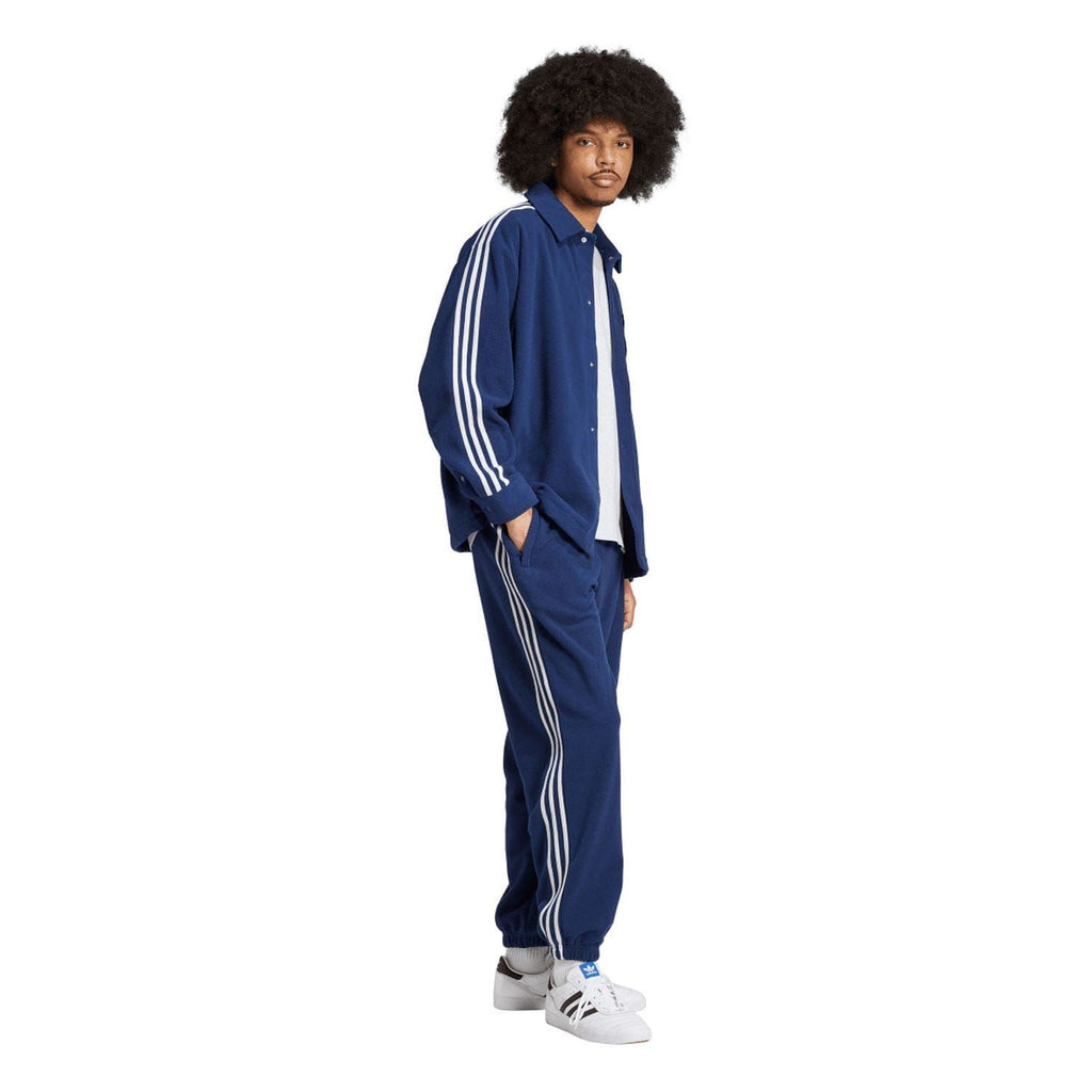 Indigo adidas fleece track shirt with stand collar and white three-stripe sleeve design