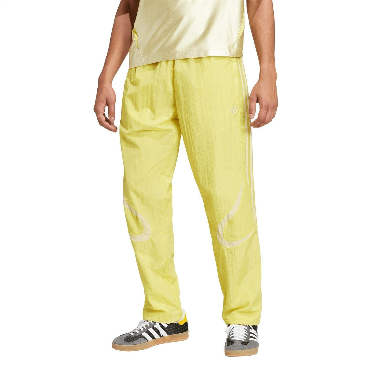 adidas Originals yellow track jogger pants, tapered fit, side adidas stripe details
