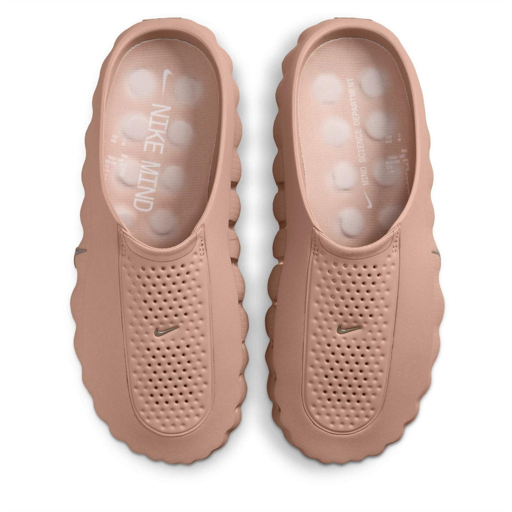 Mauve Nike slide sandals with perforated panels and Swoosh on the strap