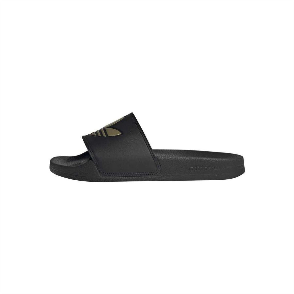 Black slide sandals, side view with wide strap and gold logo on footbed