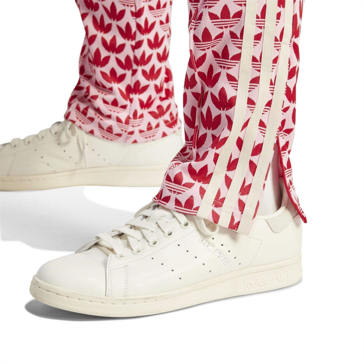 Logo print track pants with white side stripe detail and ribbed ankle cuffs