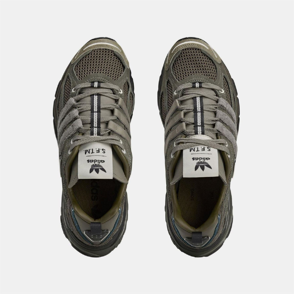 adidas Originals Cushion STFM Trainers in black with white accents, showcasing sporty footwear with cushioned soles for comfort